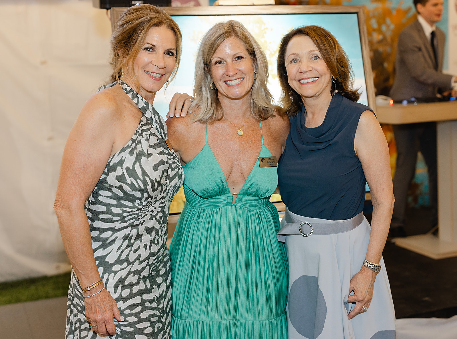  2023 Dart for Art Co-Chairs, Kathleen Davis (left) and Karen Quenneville (right) with Crooked Tree Arts Center President, Megan DeWindt (center).