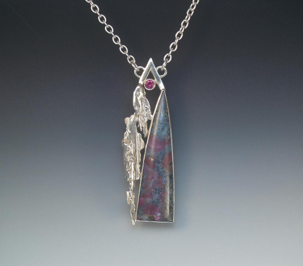 Silver broom cast pendant with ruby in kyanite cabochon